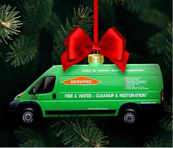 Christmas tree with SERVPRO van ornament and red bow