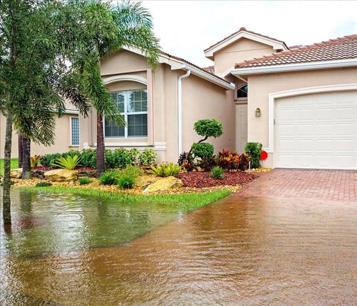 house with water flooding outside 