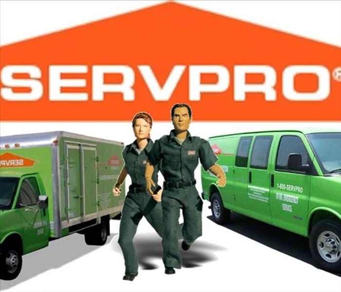 SERVPRO logo with vans and workers 