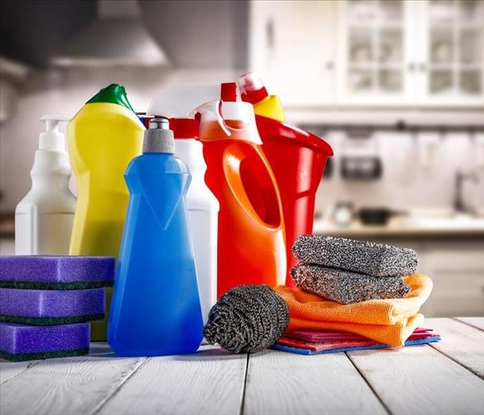 cleaning bottles on table with gloves